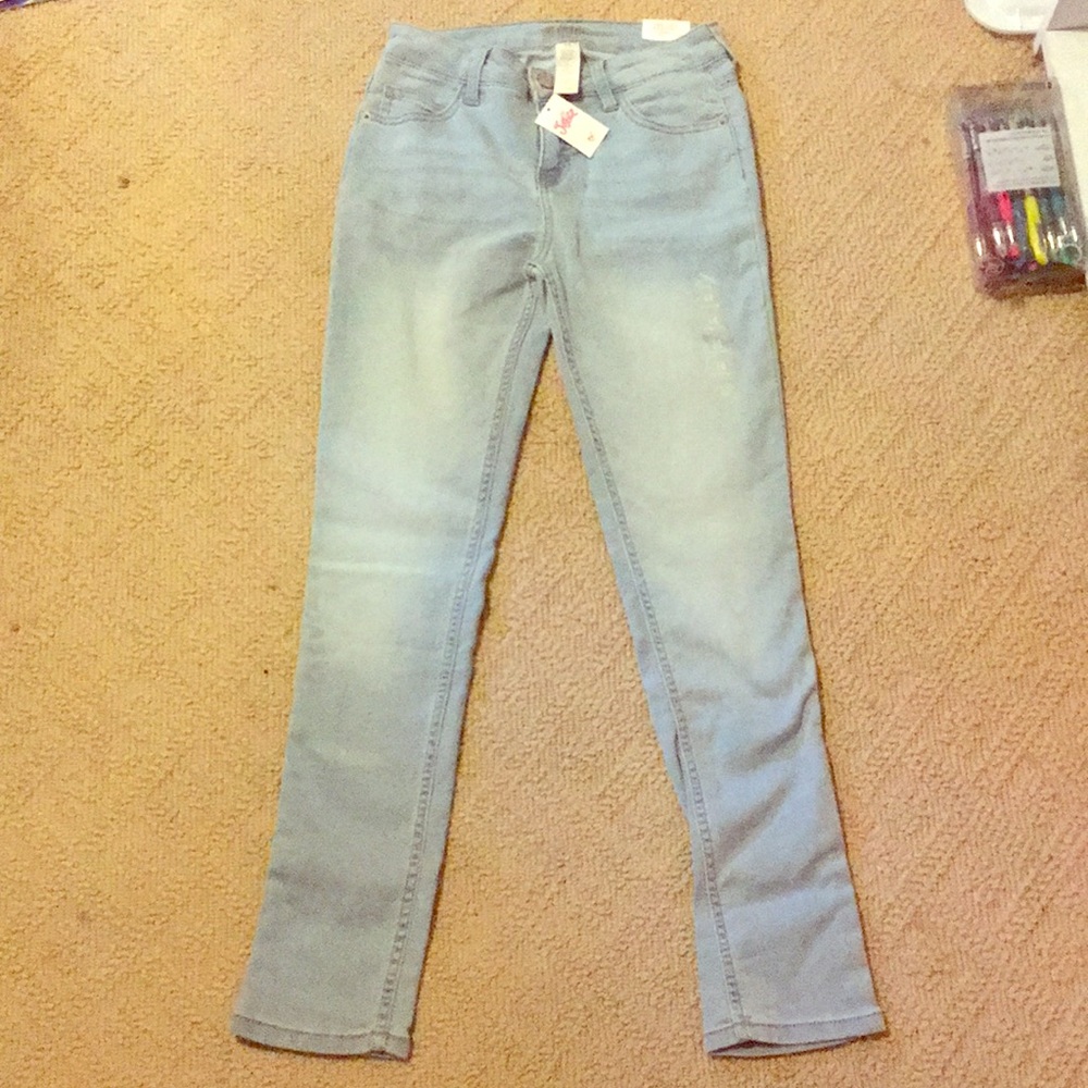 justice super skinny mid rise light wash jeans